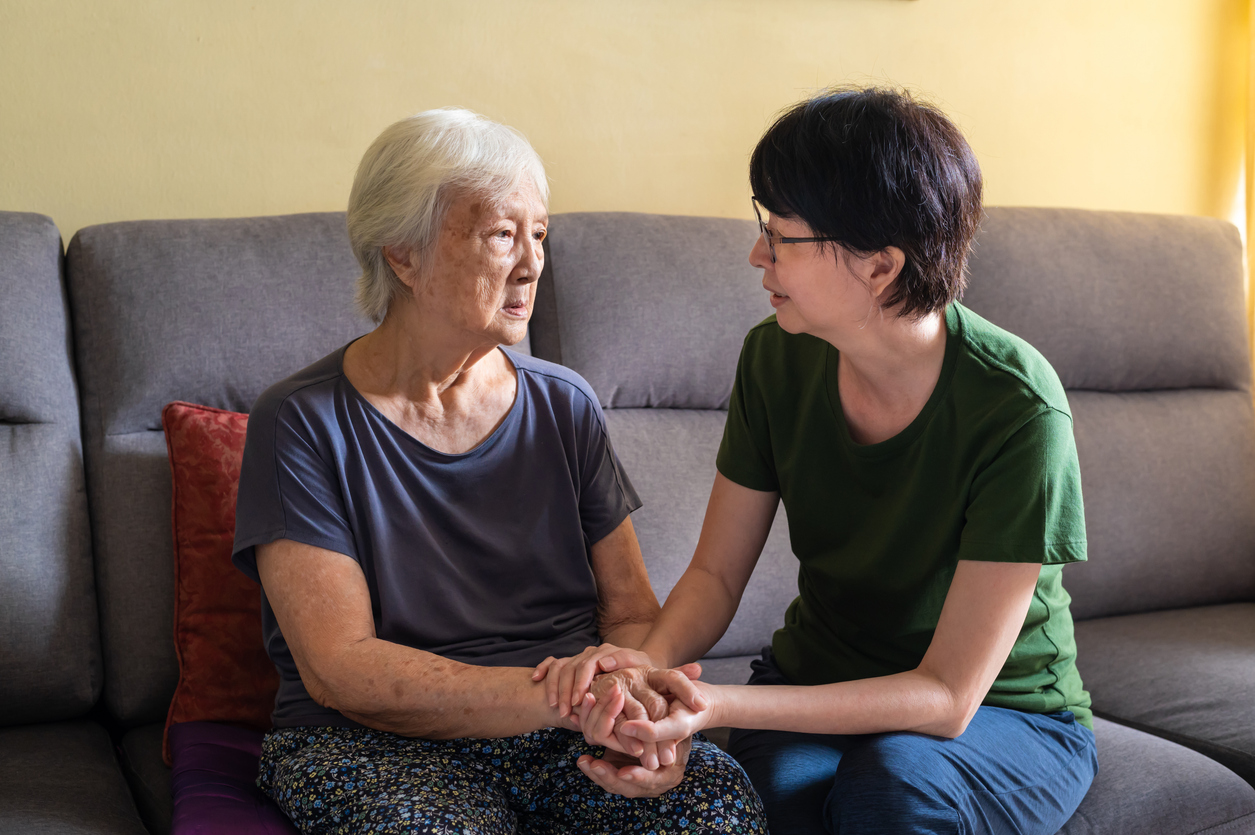Daughter discussing memory care with older parent